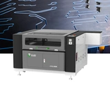 Laser equipment promotional composite with example decorative or marked sample imagery