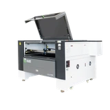 Laser machine with the upper cover open, viewed from the front and right side